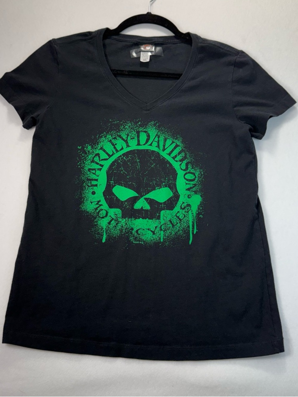 Harley Davidson Tee with Green skull logo woman’s  (Size med)